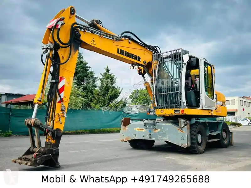 Pelle sur pneus Liebherr A316Litronic Verstellausleger *Klima/Planier occasion Must-Have