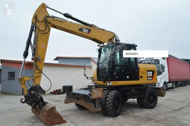 Pelle sur pneus Caterpillar 313 occasion Expédié Aujourd'hui